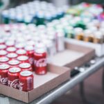 selective focus photography of red coca cola can lot on box