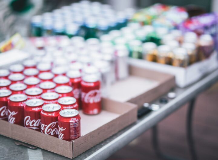 selective focus photography of red coca cola can lot on box
