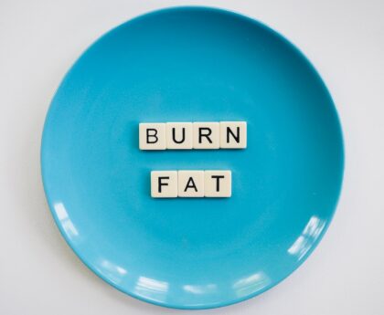 photo of a burn fat text on round blue plate
