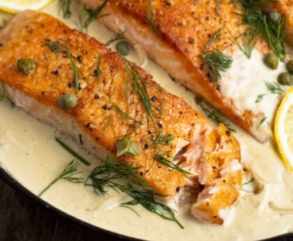 Pan-Seared Salmon with Lemon Dill Sauce, Roasted Asparagus, and Quinoa Pilaf